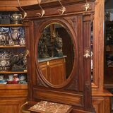 Solid walnut vestibule coat rack with oval mirror and bronze hooks
