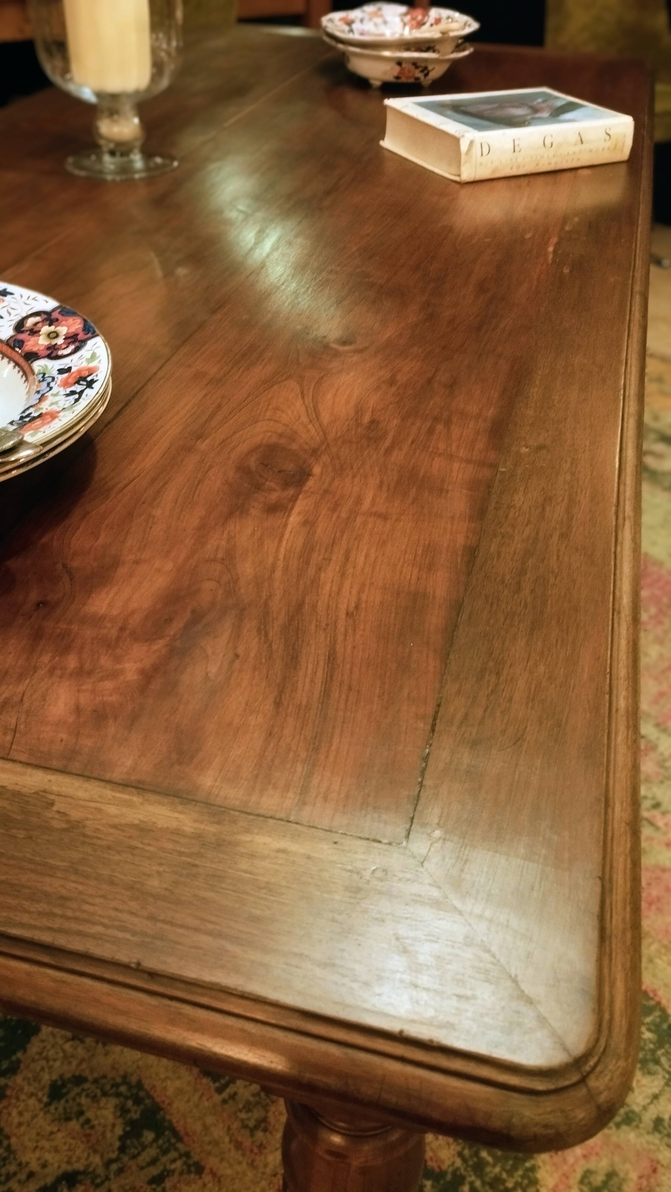 Old French farmhouse table in walnut with turned legs.