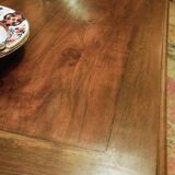 Old French farmhouse table in walnut with turned legs.