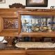 Solid wood sideboard with marble top and carved panels.