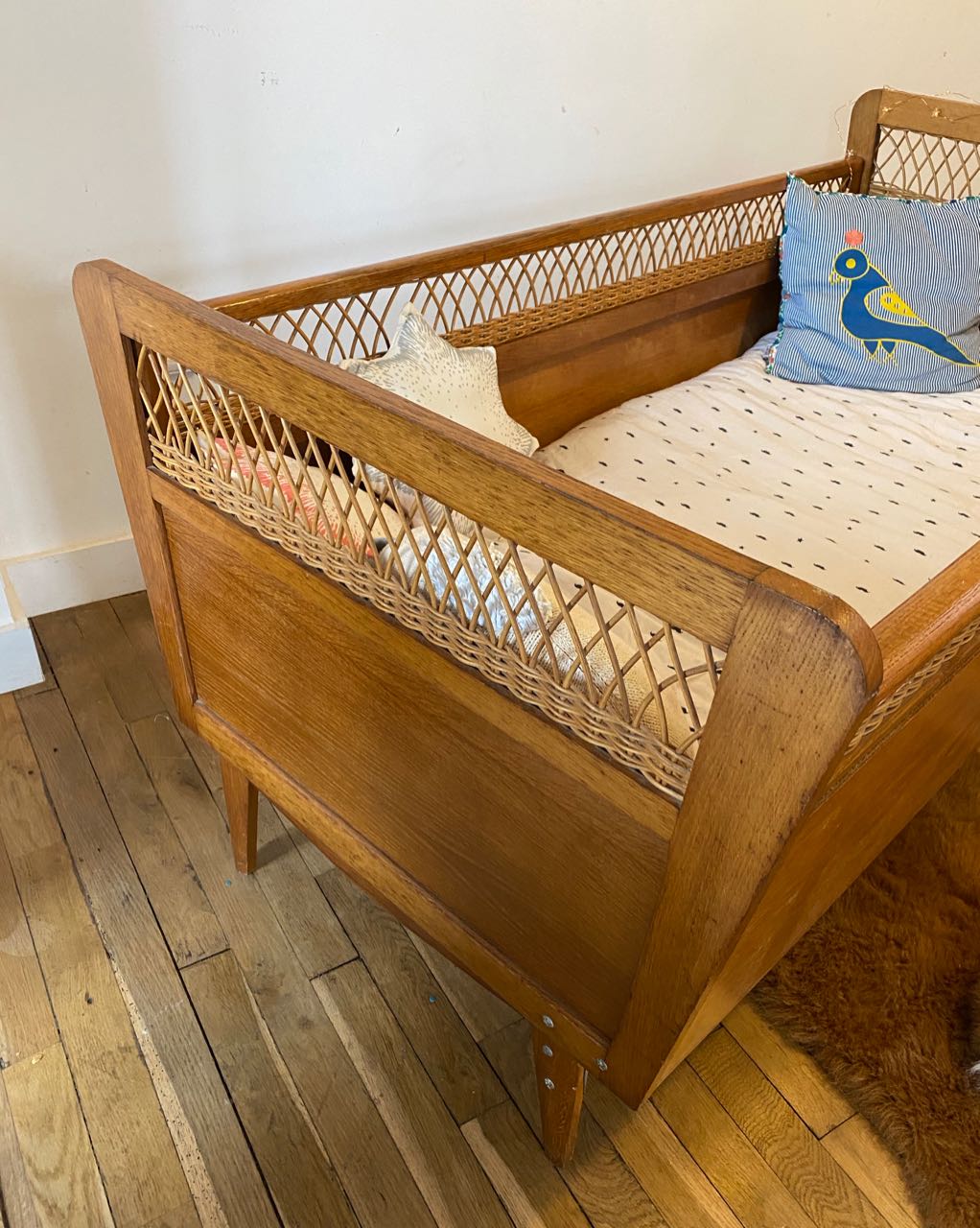Wooden and wicker baby bed