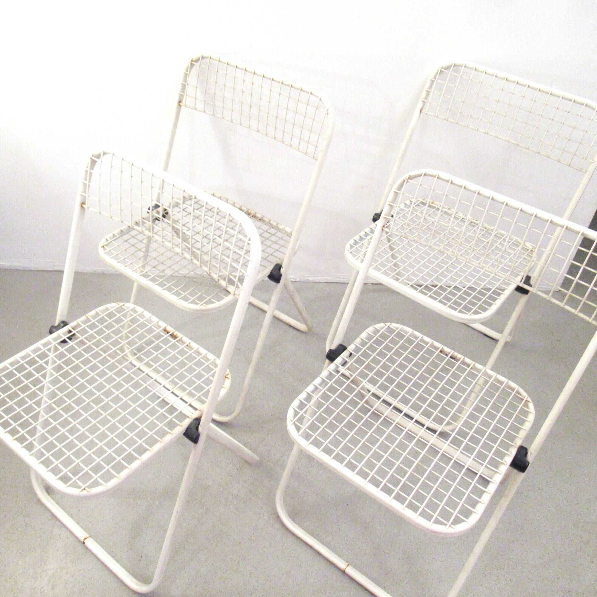 Four Talin Spa metal mesh chairs from the 1980s.