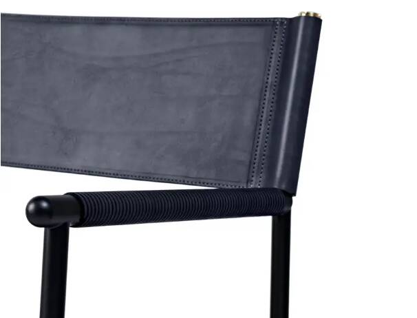 Pair of bar stools with navy blue backrest and metal frame.
