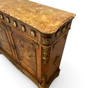 An antique French Louis XVI-style marble-top side cabinet