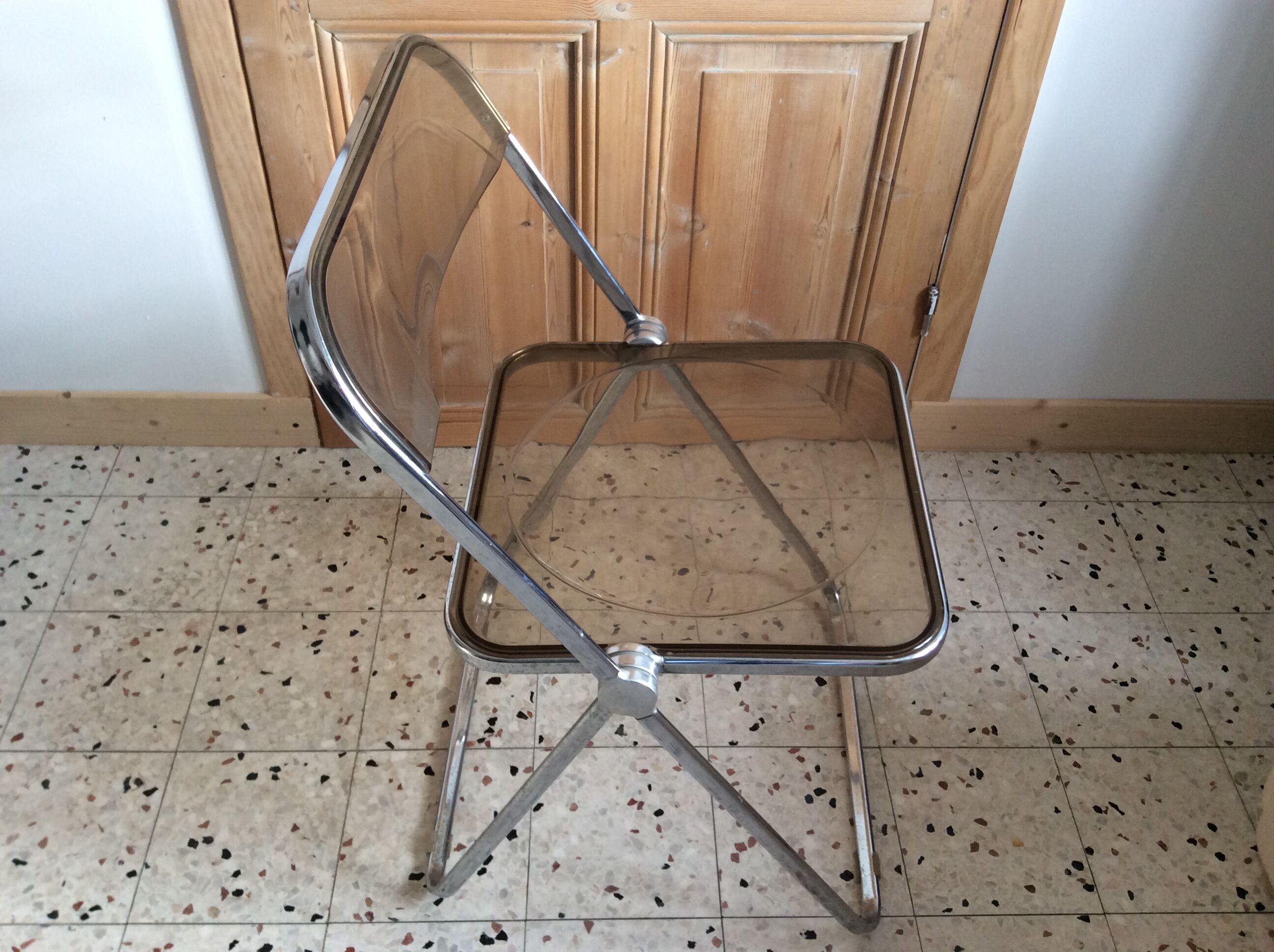 Folded chair by Giancardo Piretti for Castelli