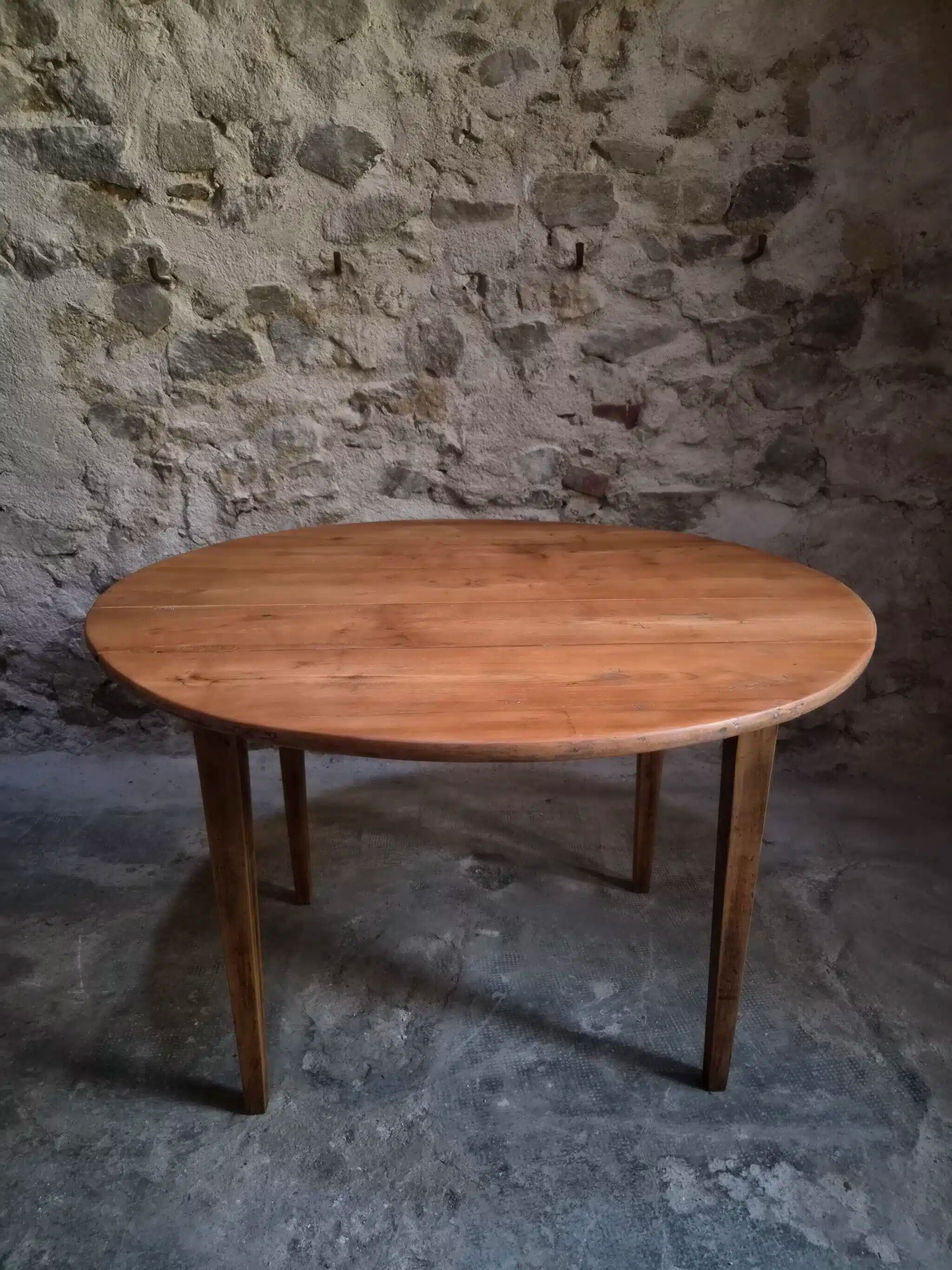 Rustic French antique dining table, drop-leaf table in cherry wood, circa 1900.