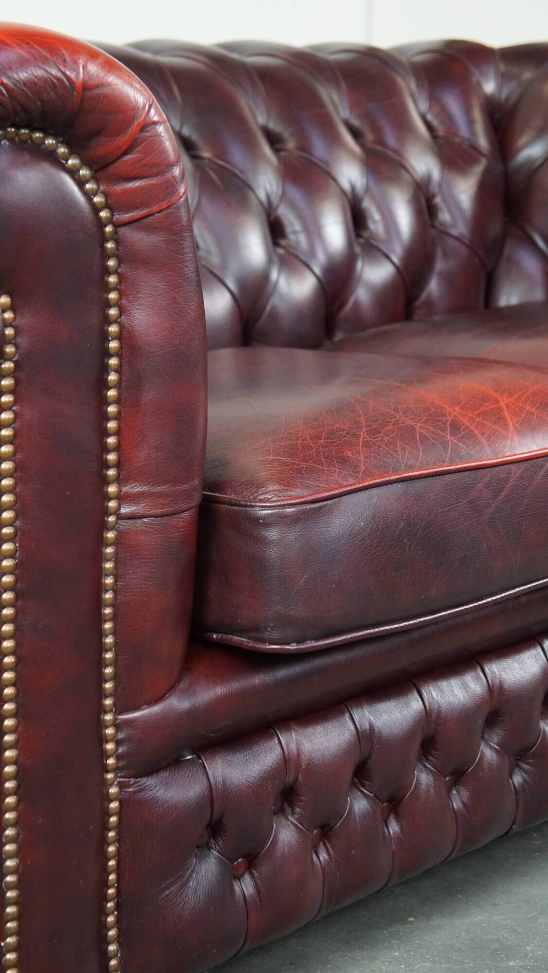 Original English Chesterfield sofa in red cowhide 2 seater