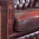 Original English Chesterfield sofa in red cowhide 2 seater