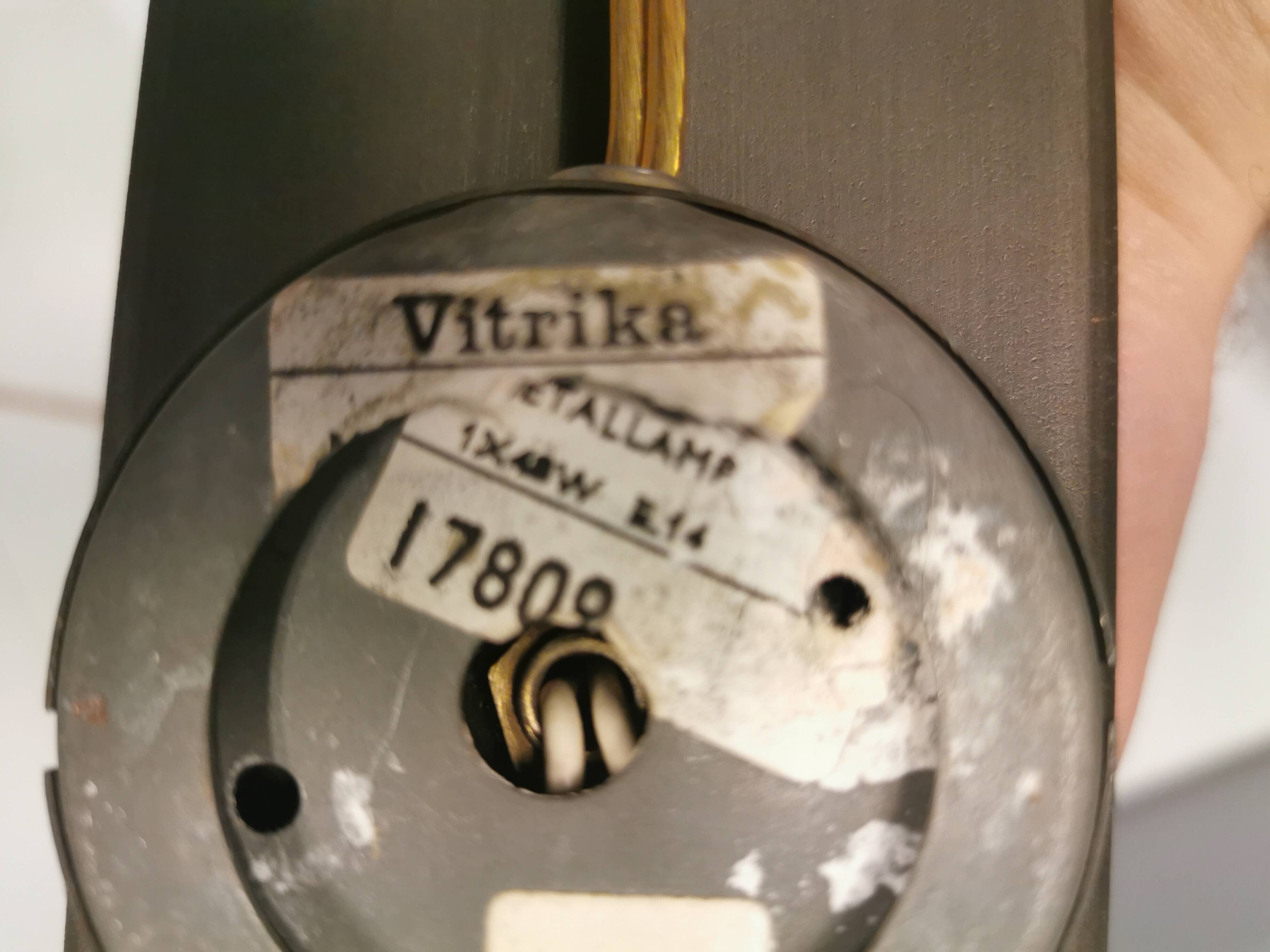 A set of Vitrika Denmark, cast iron wall lights with red details.