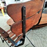 Folding garden chair with teak slats on a wrought iron structure