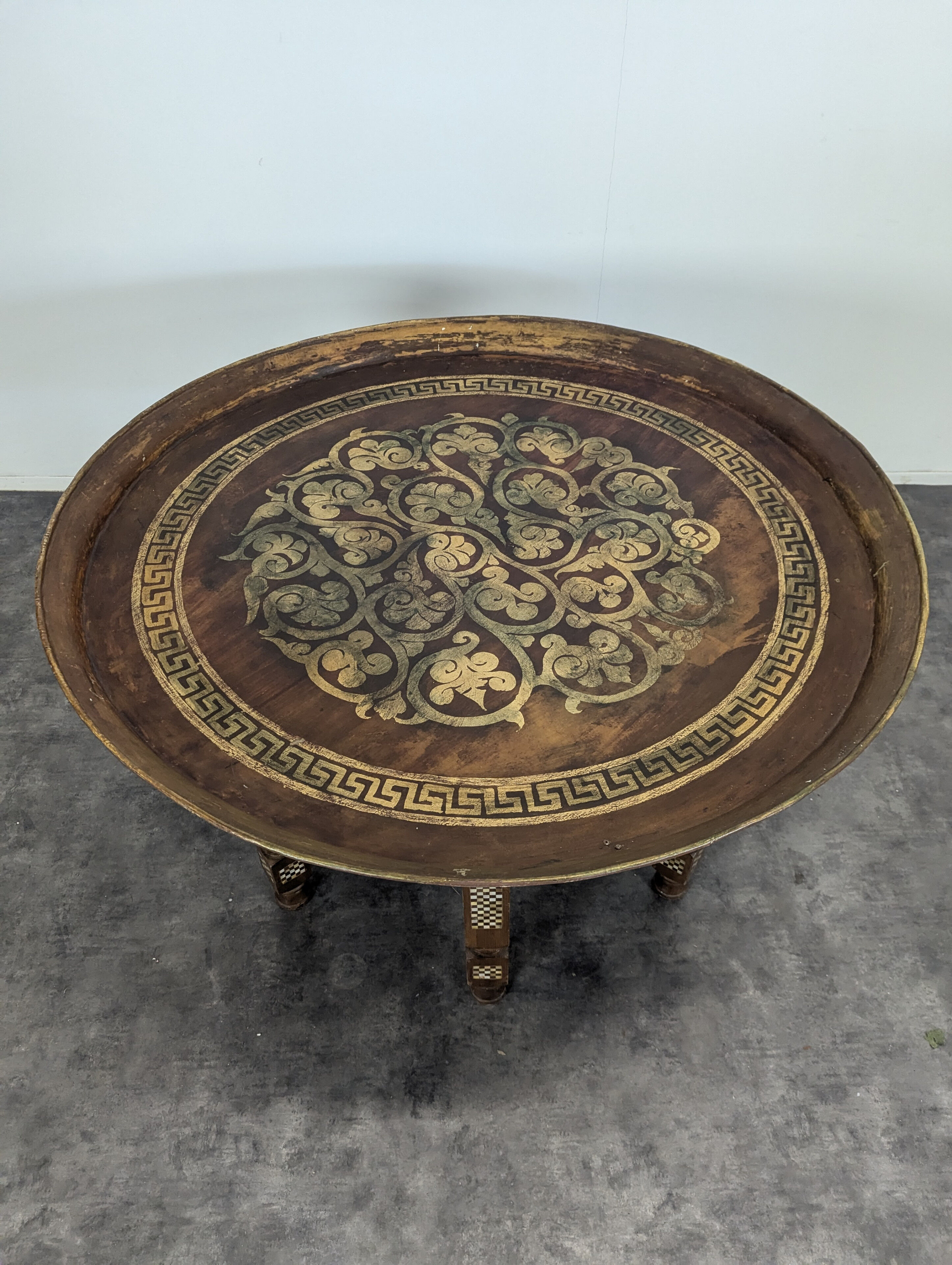 Moroccan table with painted sheet metal top and mother-of-pearl inlay