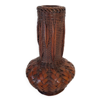 Glass vase and woven straw