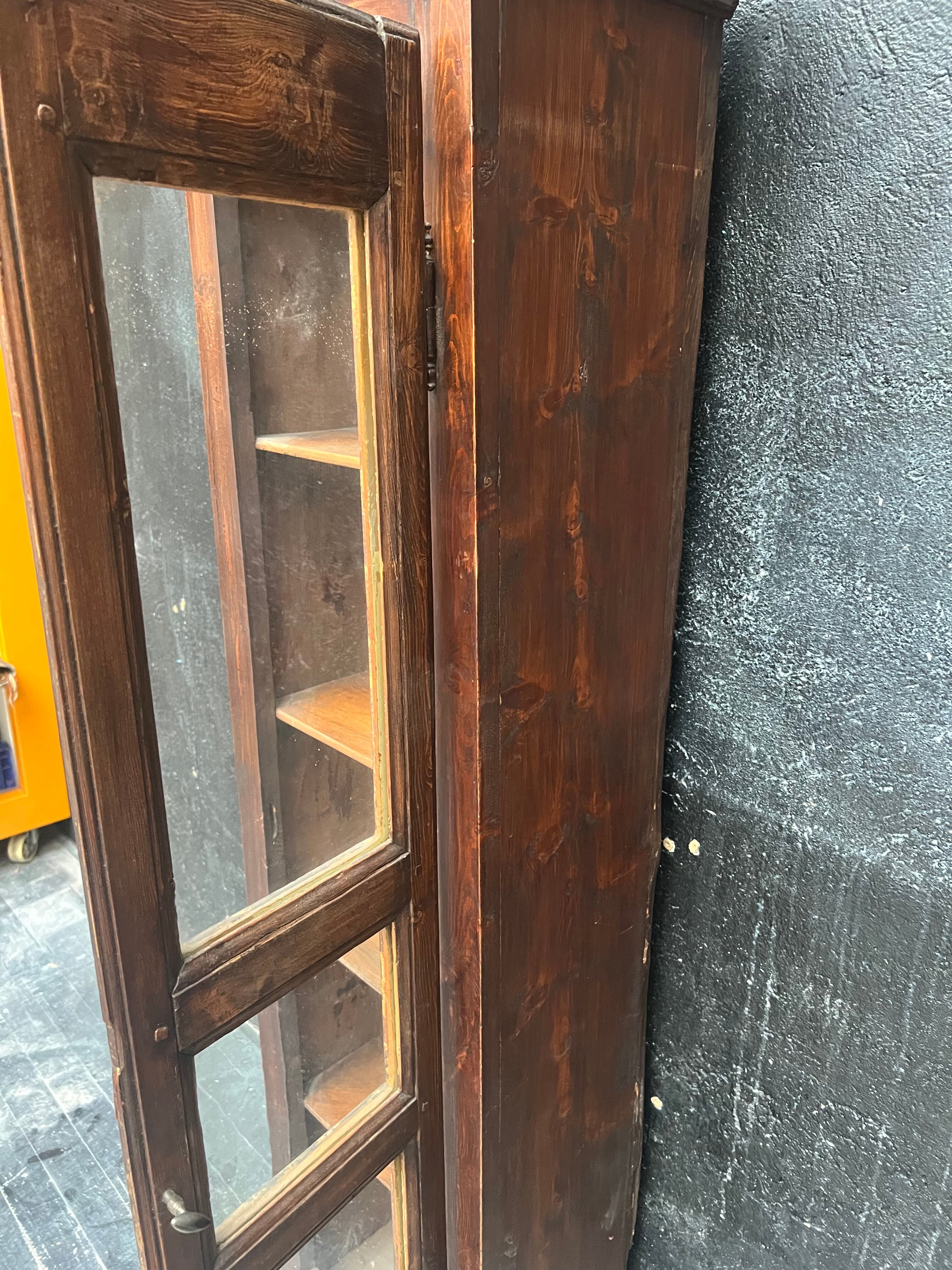 Old narrow wooden showcase.