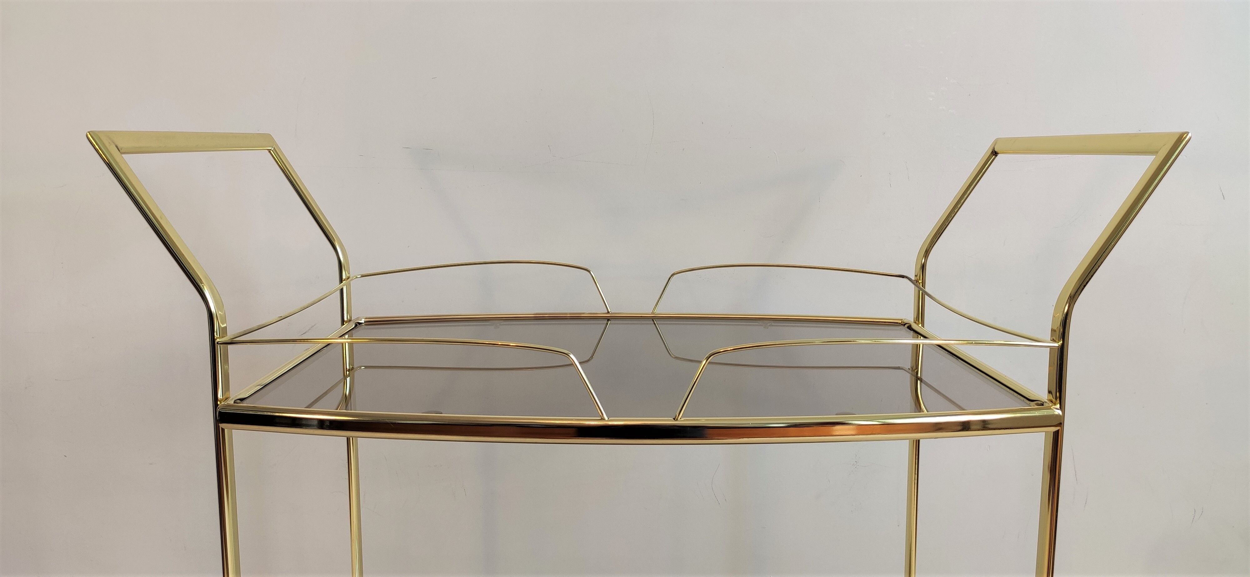 Serves golden trolley bar with wheels, in golden brass of the 80'S