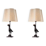 Pair of patinated bronze table lamps depicting a falcon