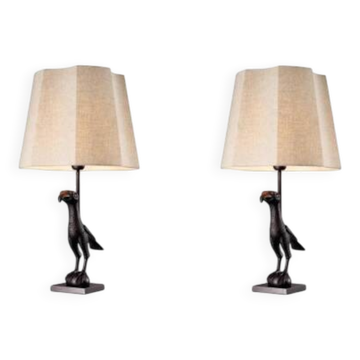 Pair of patinated bronze table lamps depicting a falcon