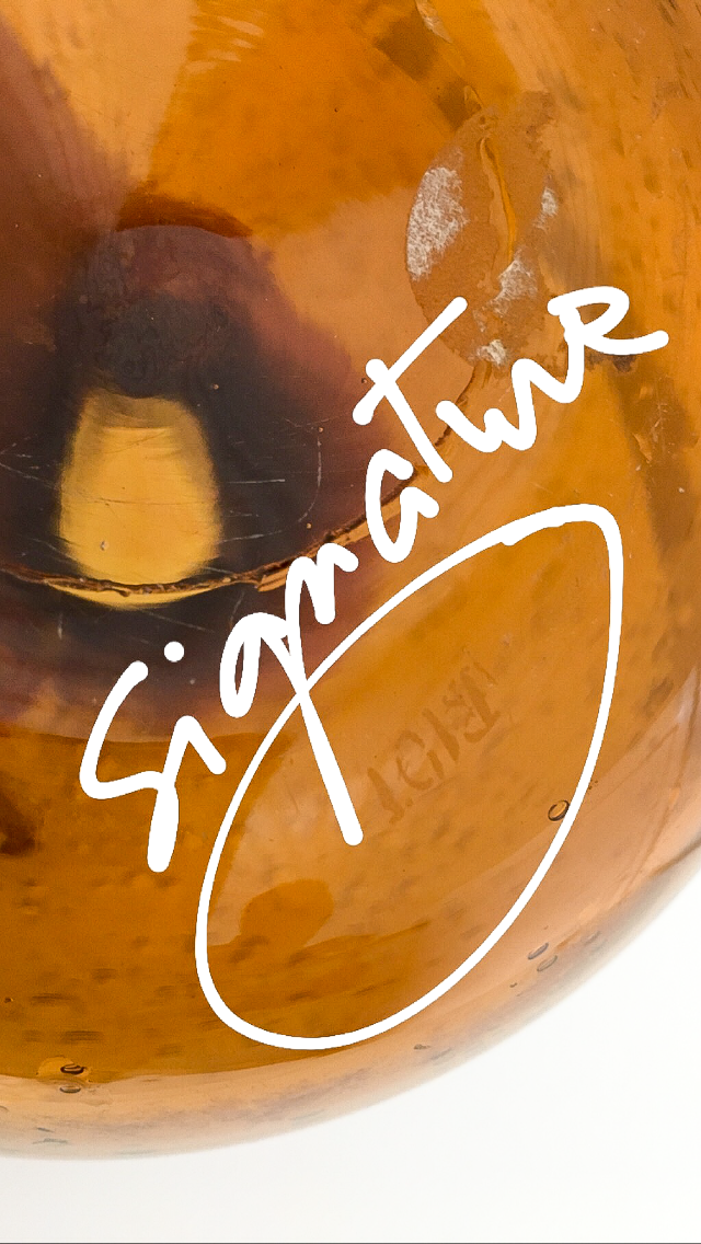 Biot blown glass amber bottle