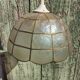 Mother-of-pearl and brass suspension