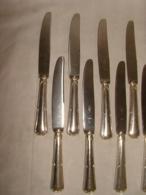 12 table knives with trilobate handles by the brand "G.Vivier"