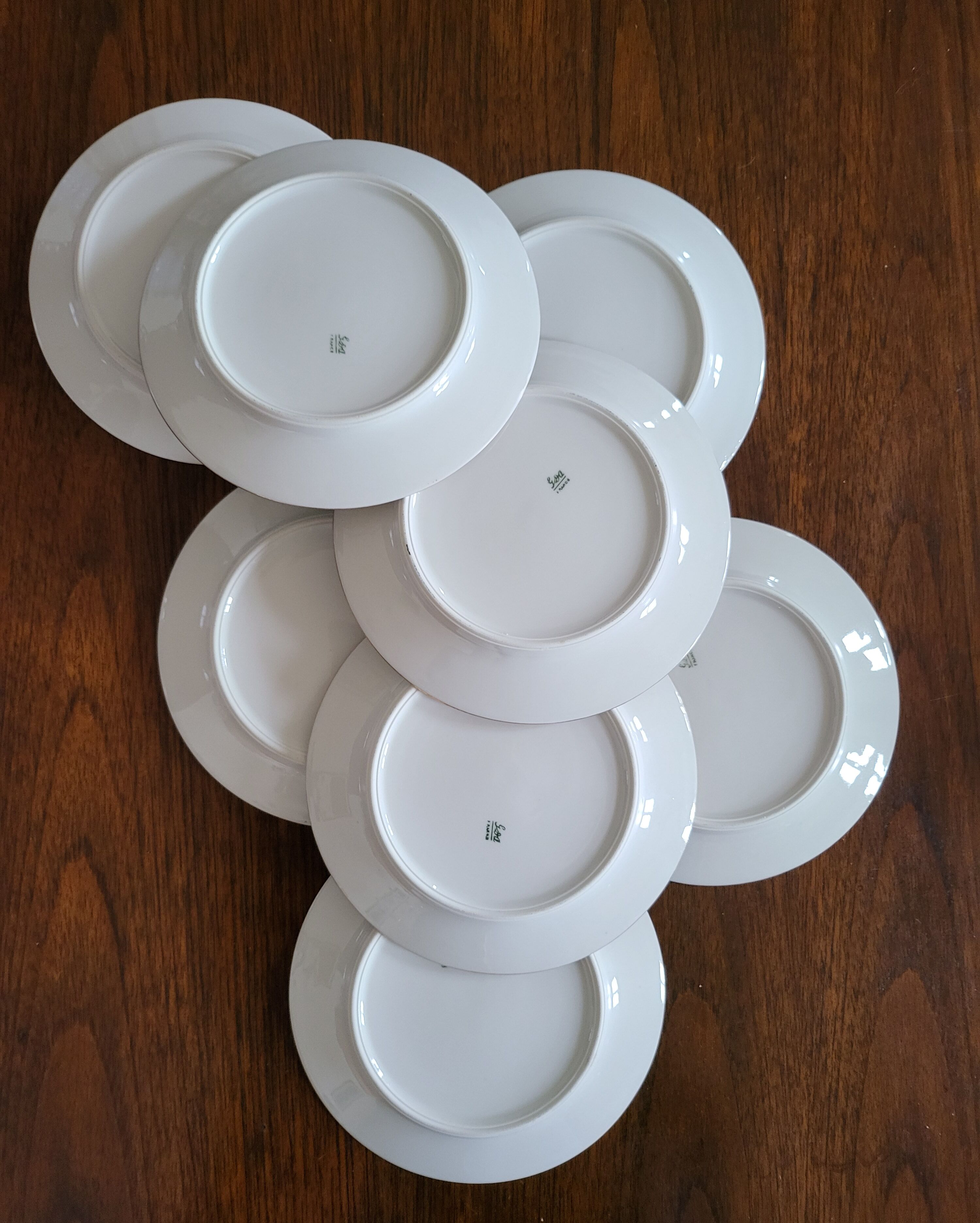 Lot of 8 small porcelain bread plates.