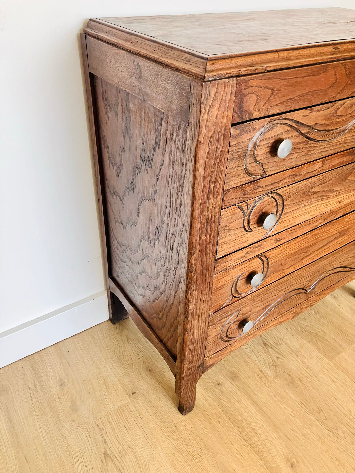 Antique commode with carved relief
