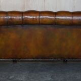 Pair of leather Chesterfield sofas by Howard & Sons