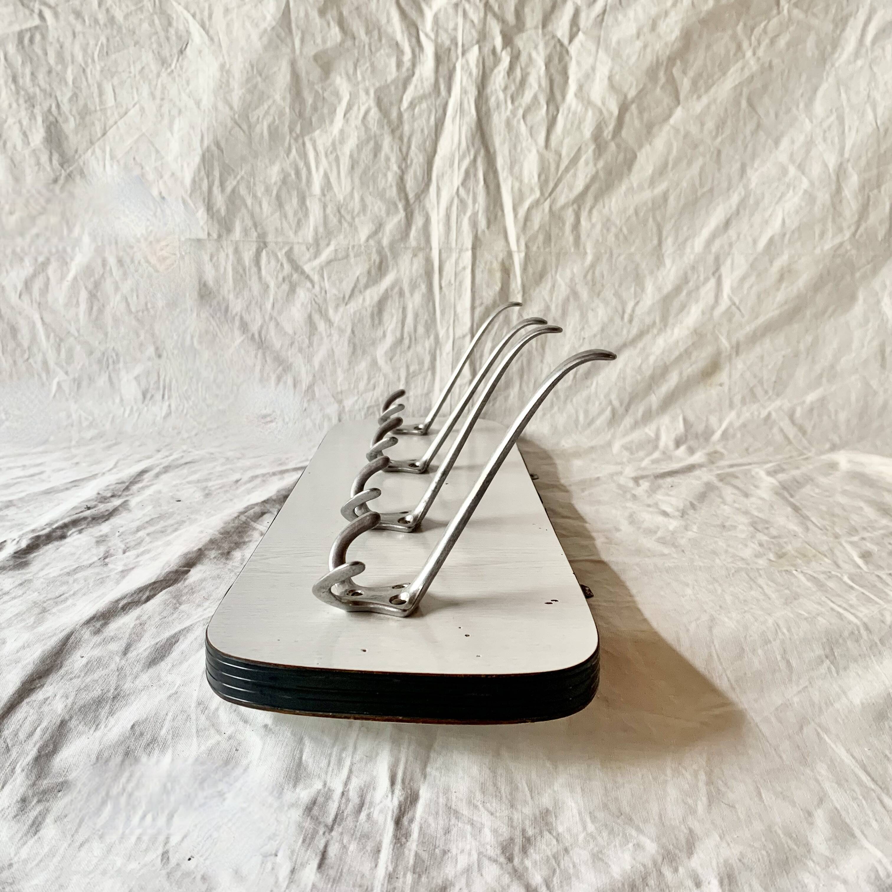 Vintage wall coat rack in white Formica - 4 cast aluminum coat hooks