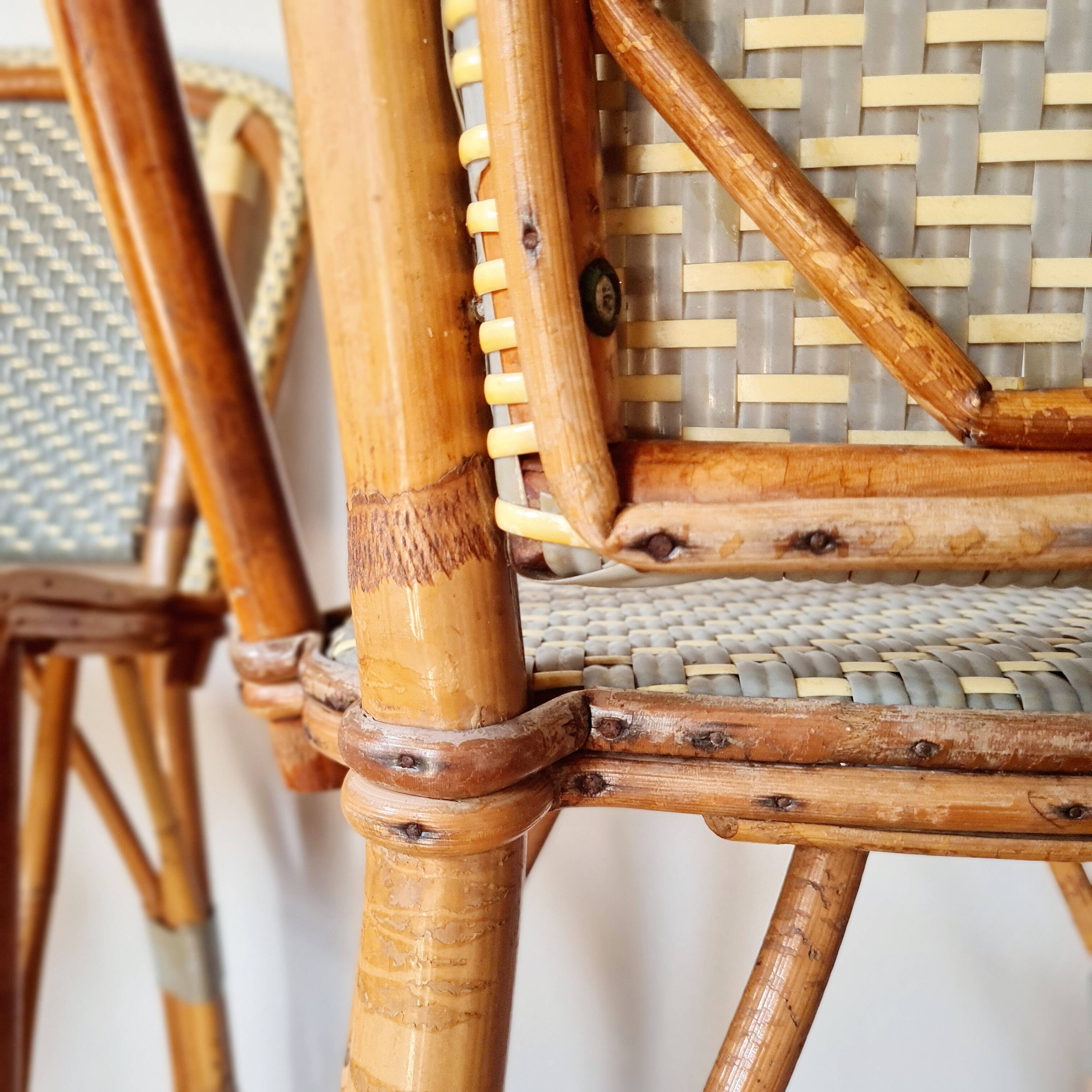 Pair of vintage Gatti bar stools in two-tone rattan and caning.