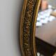 Oval gold mirror in Napoléon III style