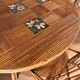 Round dining table Audoux Minet with 4 chairs and 2 armchairs.