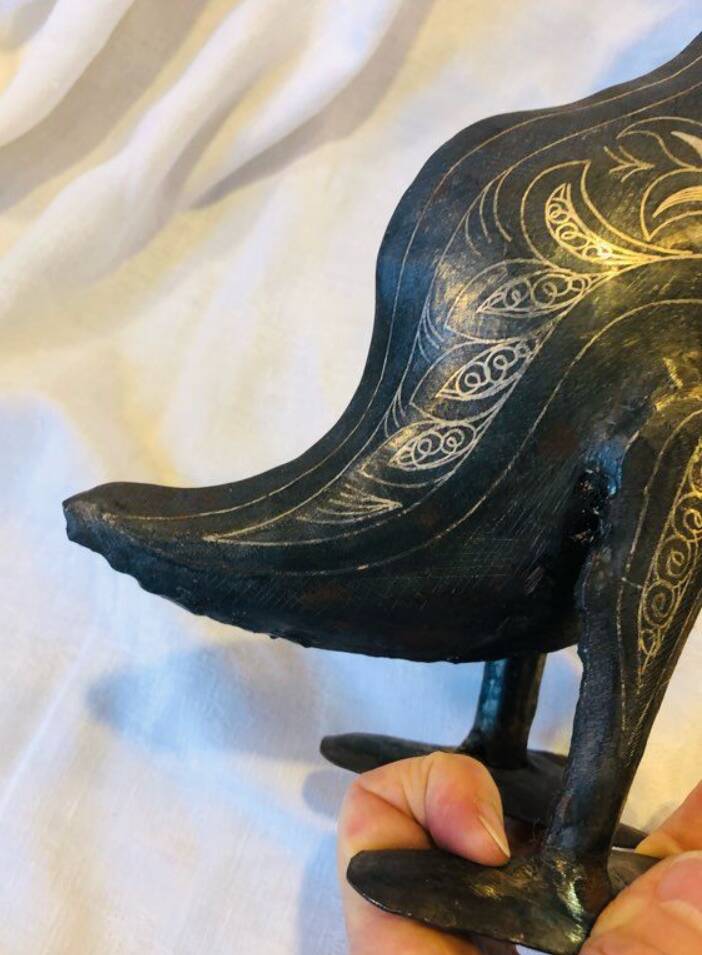 Damascened metal bird sculpture