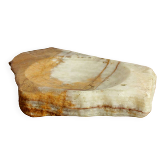 Empty pocket in orange and white marble ashtray