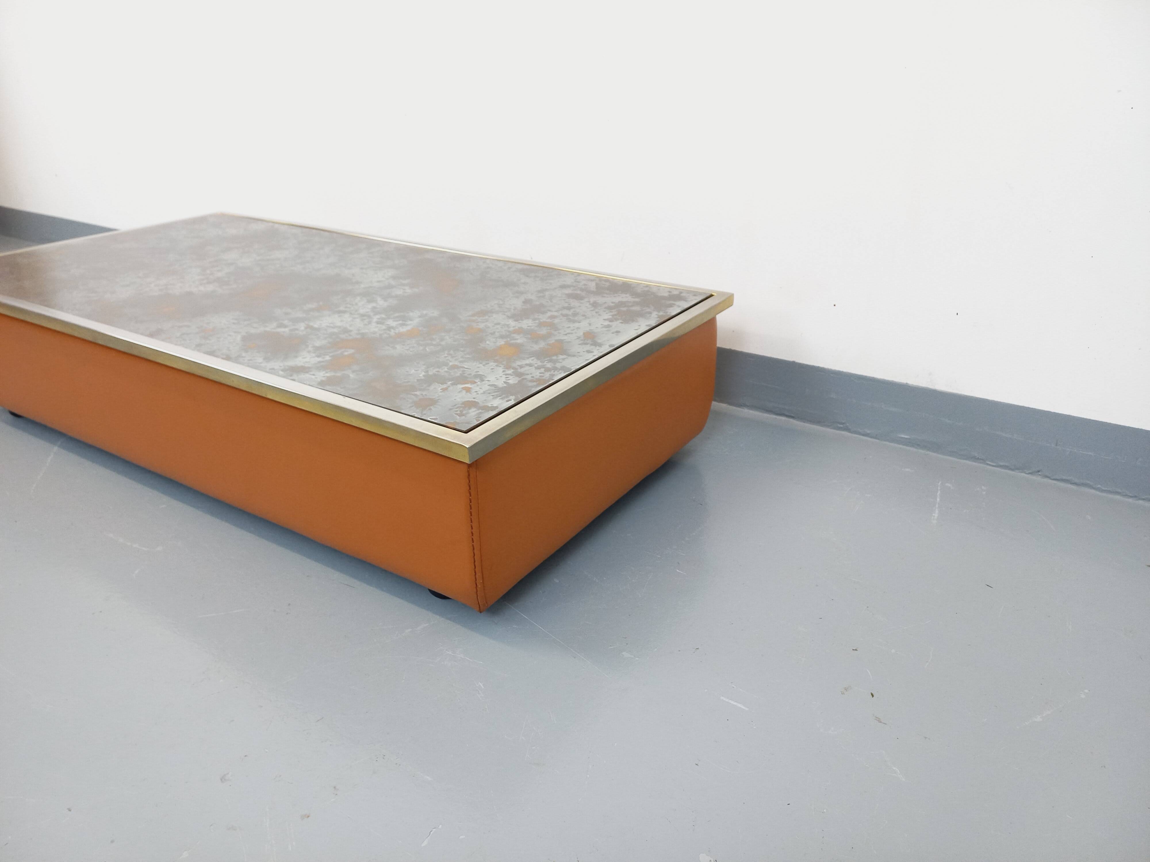 Vintage coffee table in églomisé glass, chrome and leather from the 70s