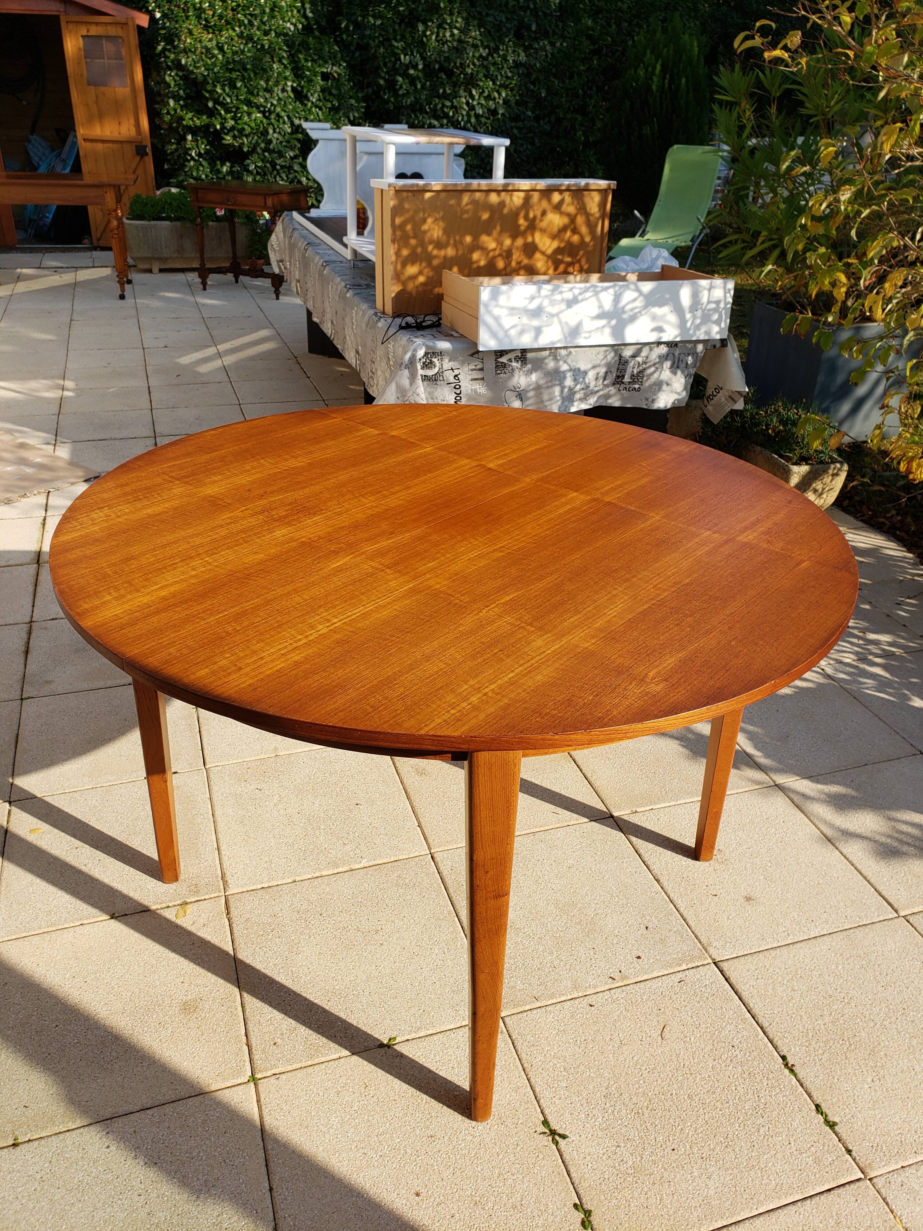Round extendable teak dining table from the 60s