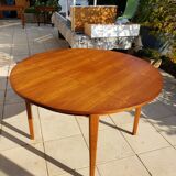 Round extendable teak dining table from the 60s