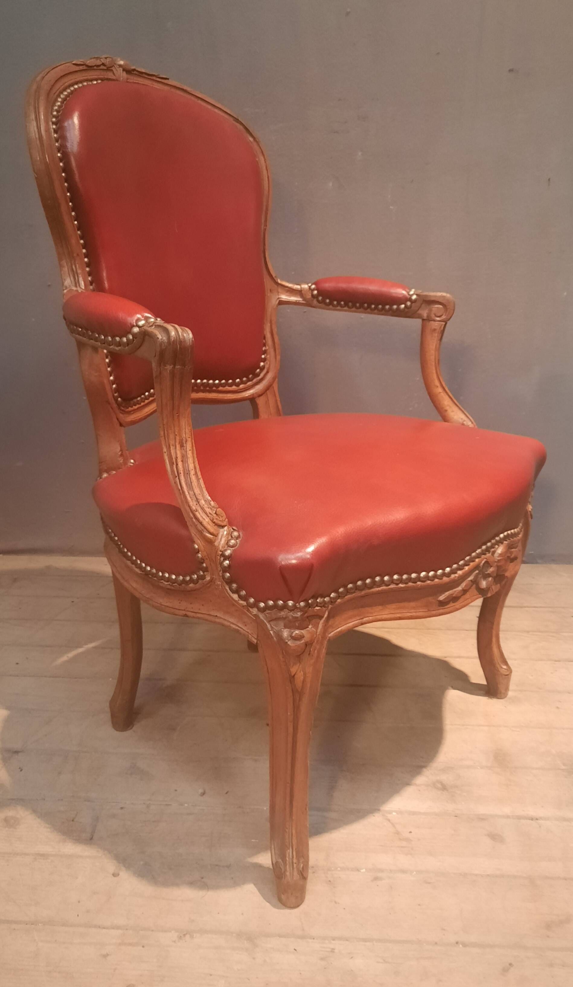 Louis XV period armchair covered in leather.