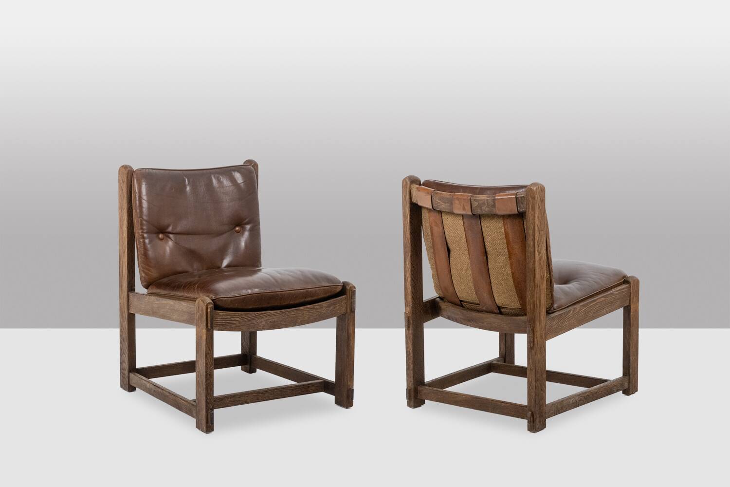 Pair of oak armchairs, upholstered in leather. Work from the 1960s.