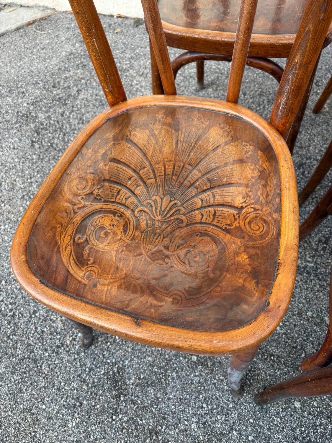10 varnished patterned bistro chairs