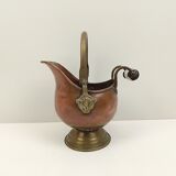 Copper pot cover and a pitcher-style brass handle