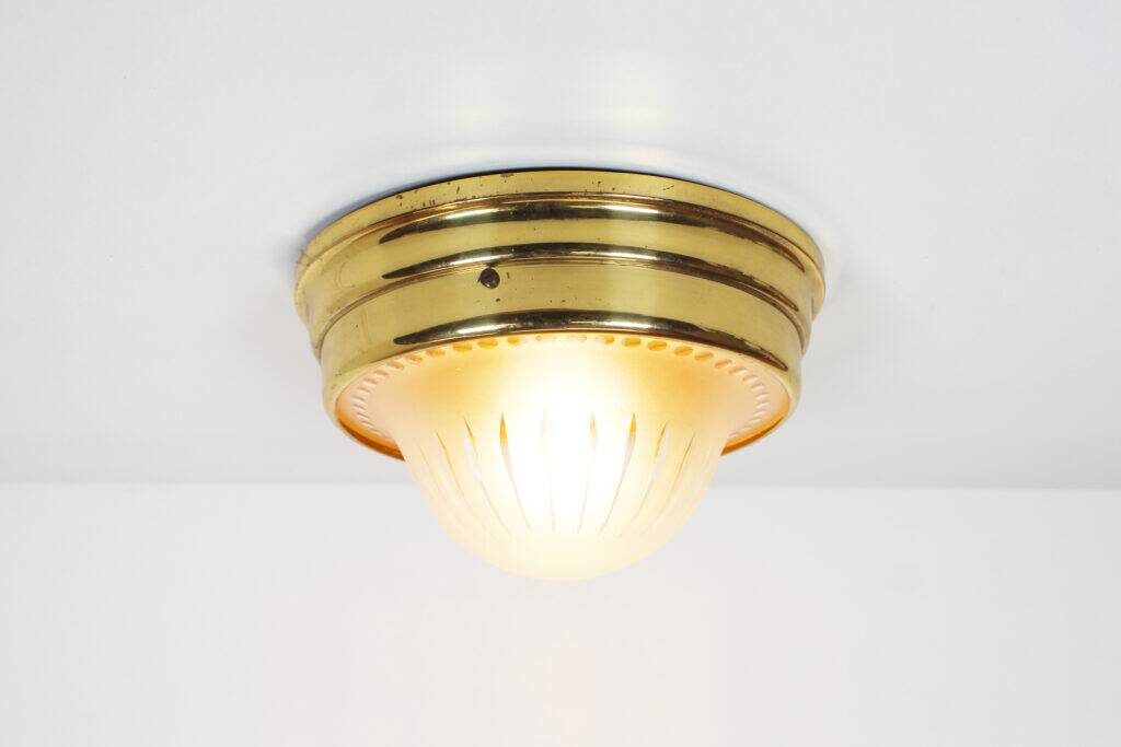 Single vintage brass ceiling light with glass globe