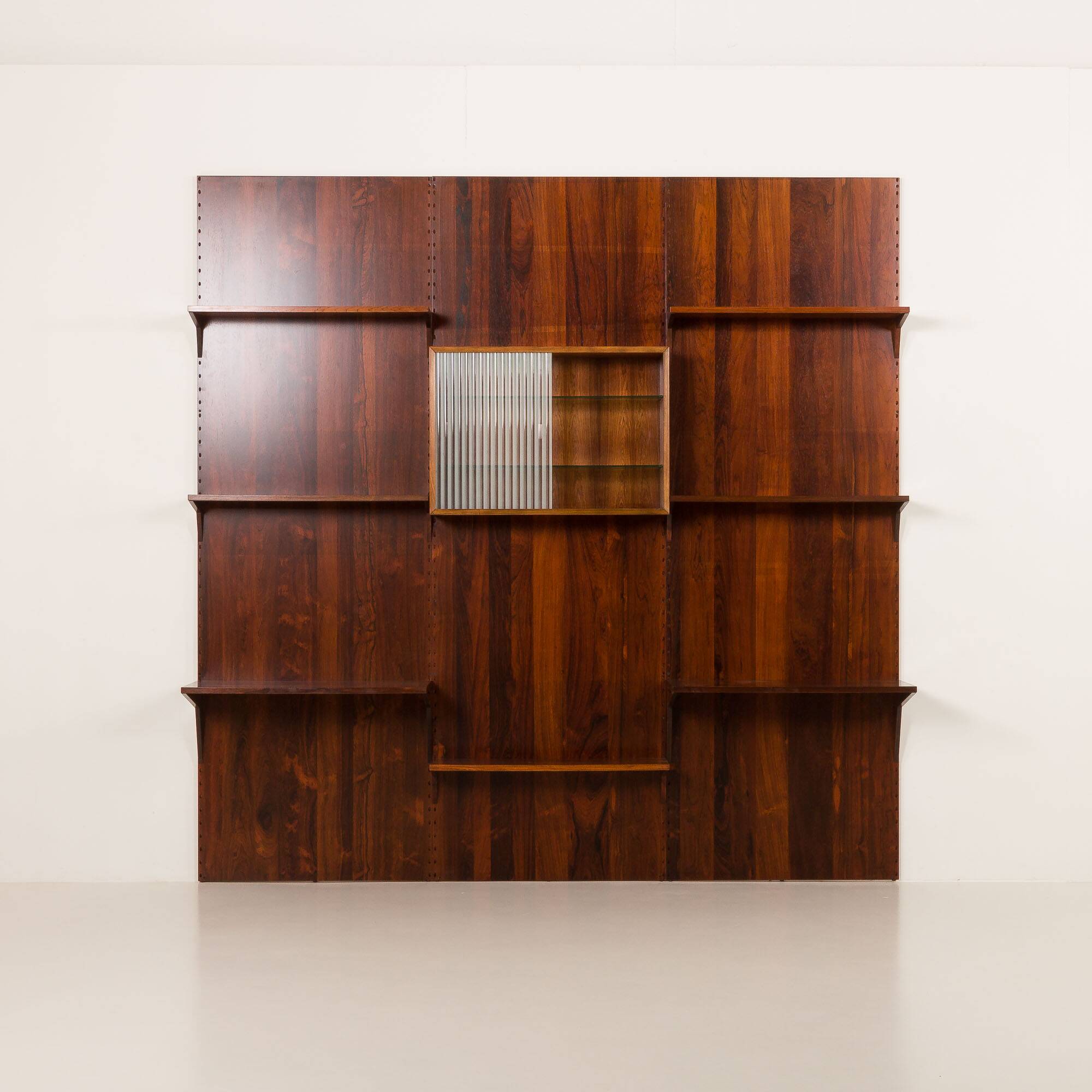 Poul Cadovius rosewood wall unit on panels for Cado, Denmark 1960s
