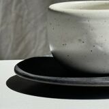 White Indonesian ceramic cup and gray saucer