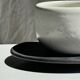 White Indonesian ceramic cup and gray saucer