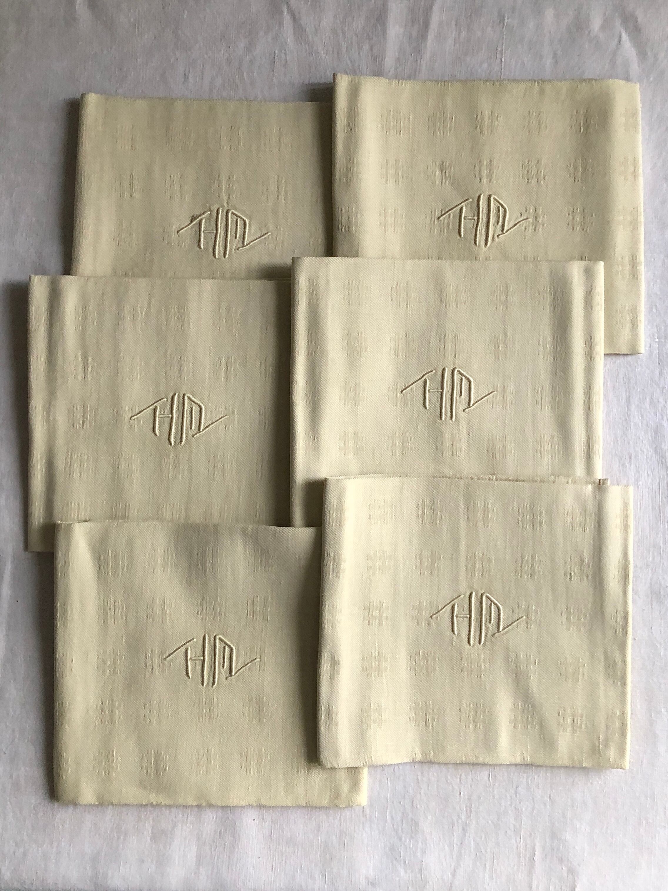 Antique napkins damascus and monogrammed tinted fresh butter