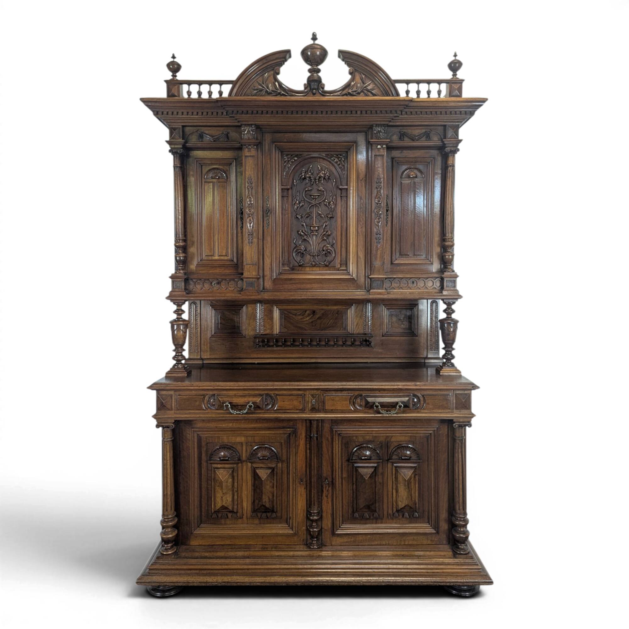 Large buffet with 2 bodies in Renaissance style made of solid walnut.