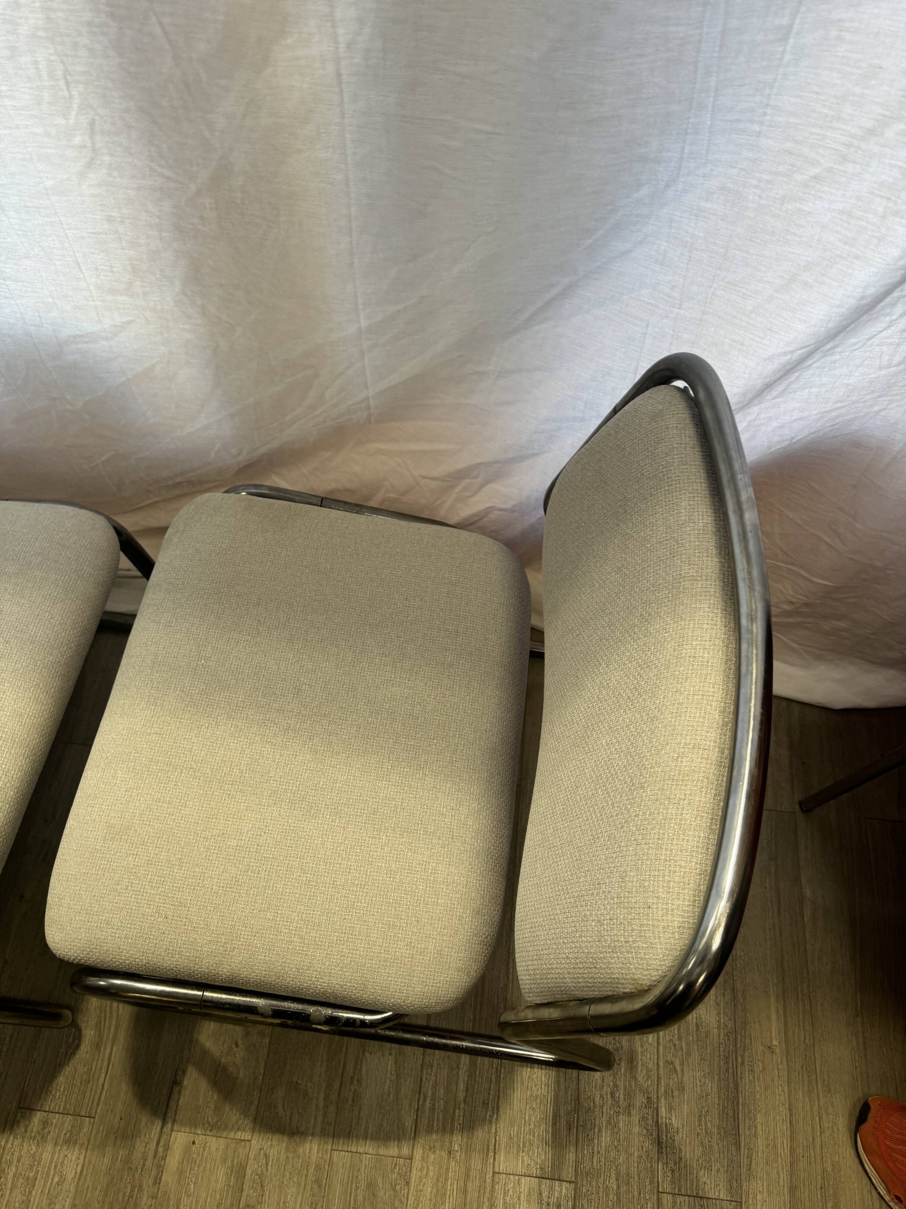 Pair of 70s tubular armchairs