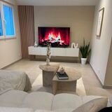 Half-moon travertine coffee table