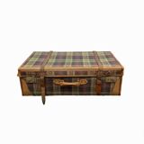 Old large suitcase in leather and tartan fabric