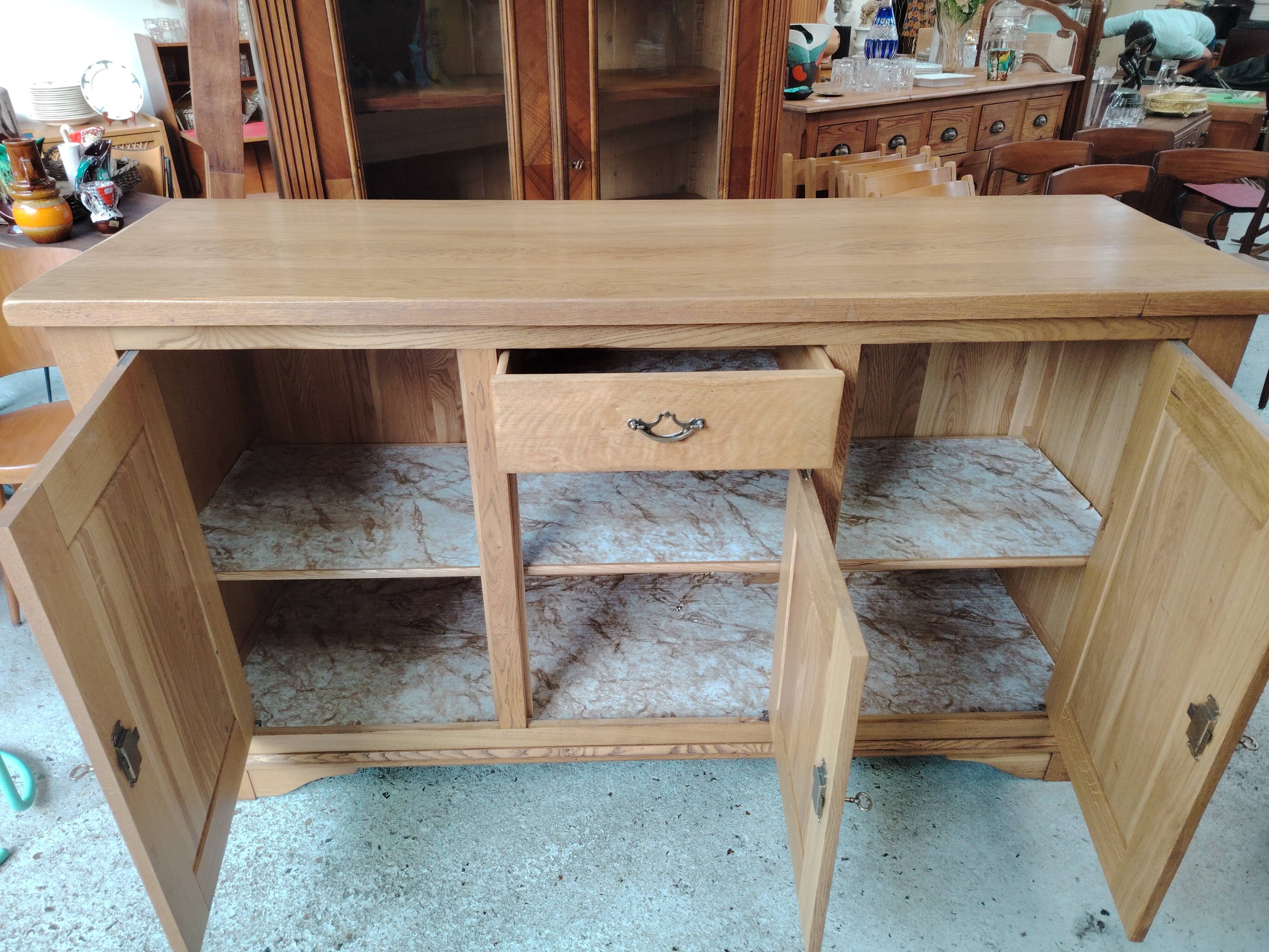 Low sideboard in light solid oak with 3 doors and 1 drawer.