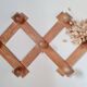 Wall-mounted accordion coat rack in solid pine